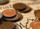 Coins scattered on financial section of newspaper &copy; EC
